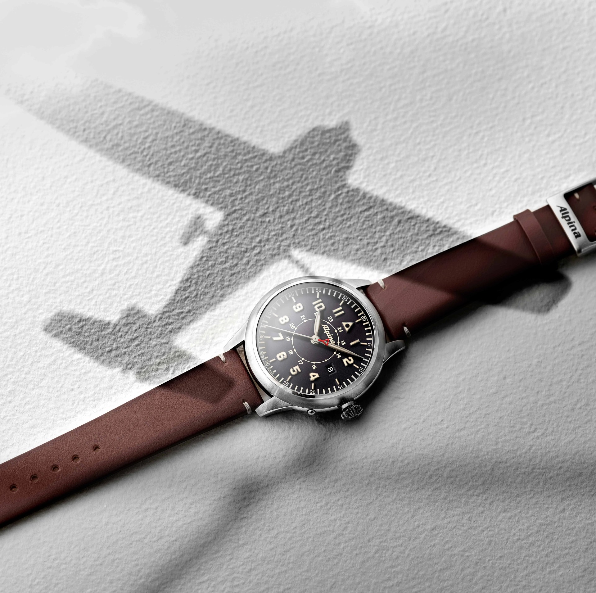 pilot watch with airplane shadow