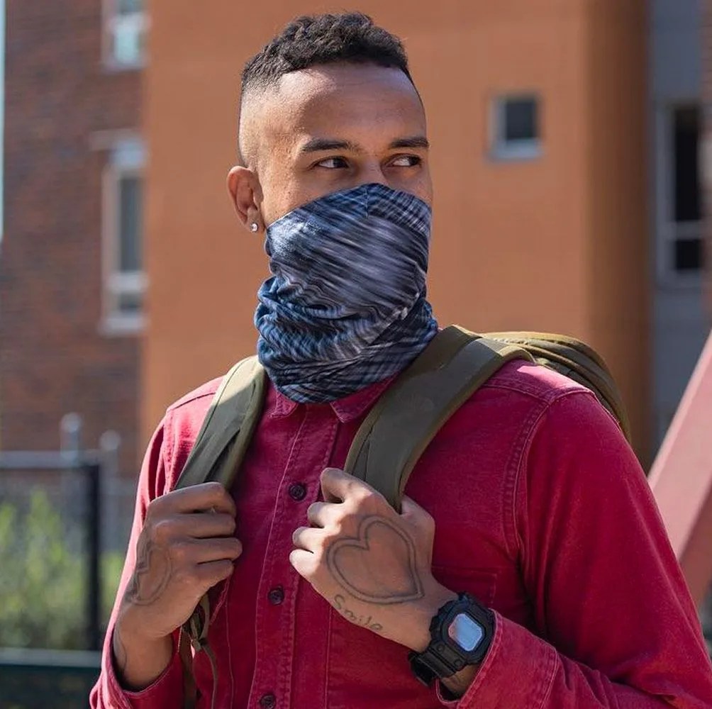 a man wearing a neck gaiter as a face mask