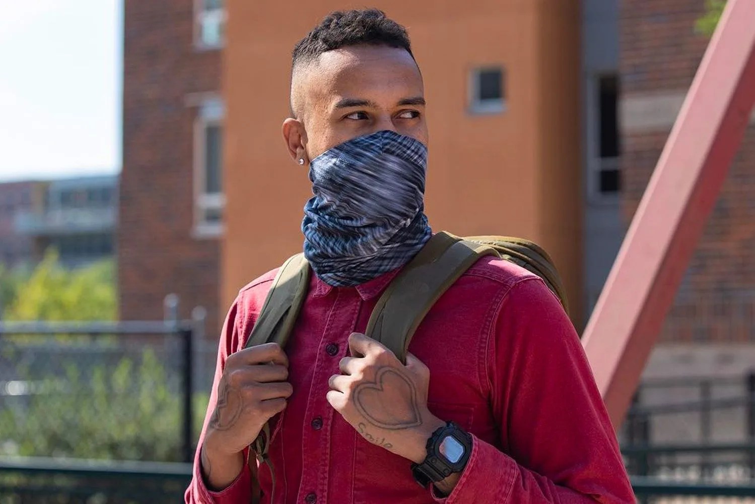 a man wearing a neck gaiter as a face mask