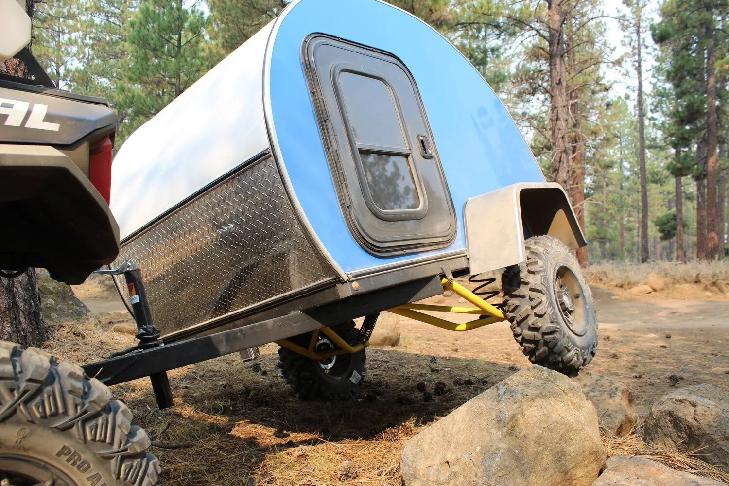 the boony stomper off road trailer on rocks