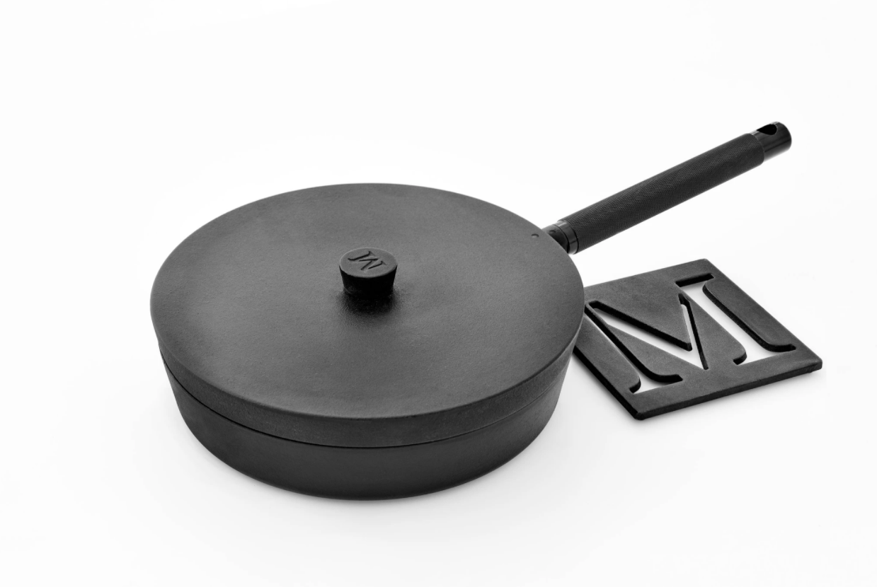 cast iron pan with lid and trivet