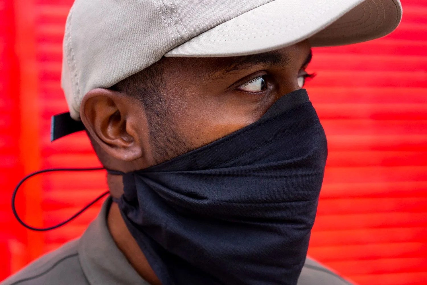 a man wearing a bandana style face mask