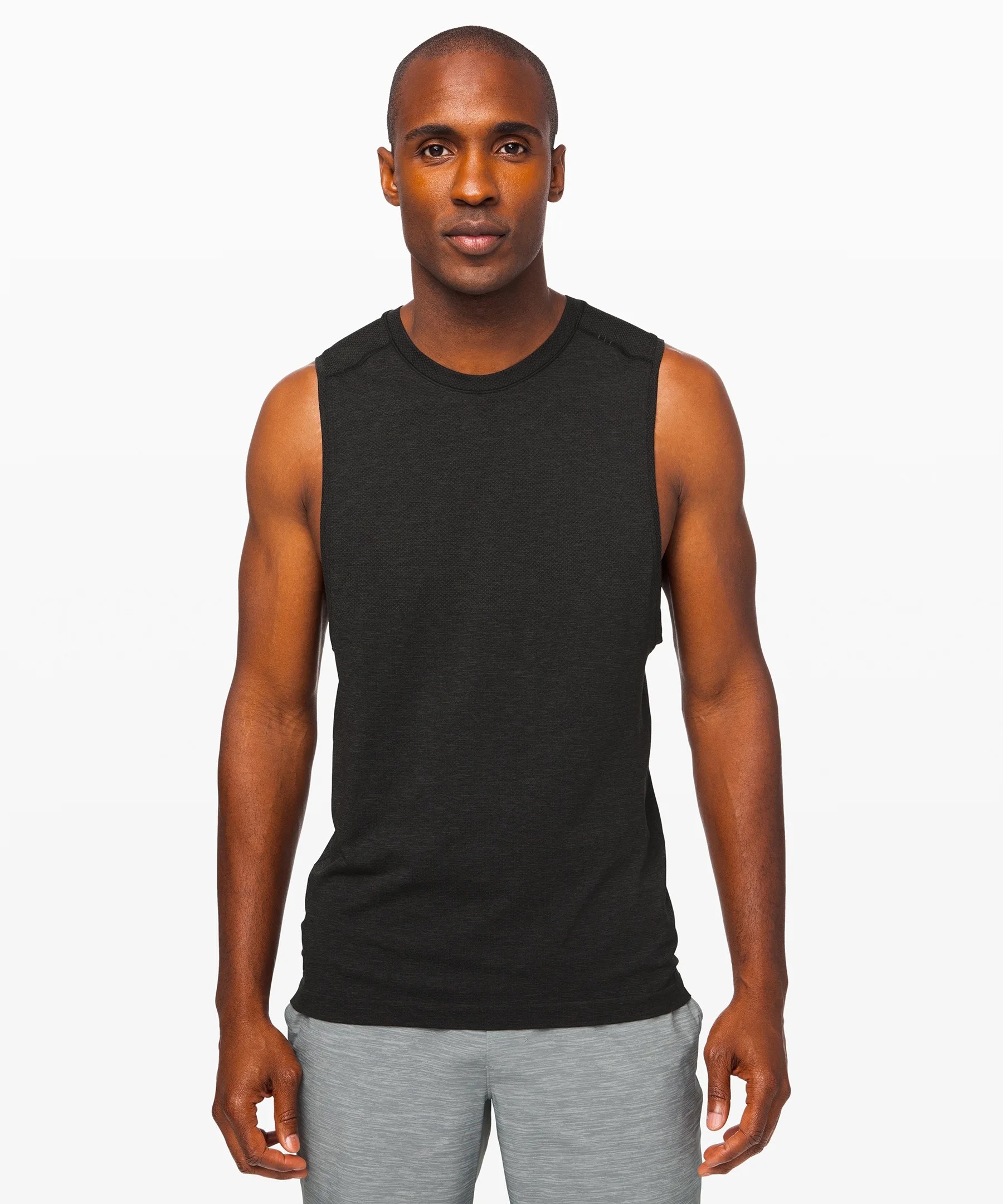 a man wearing a black sleeveless shirt