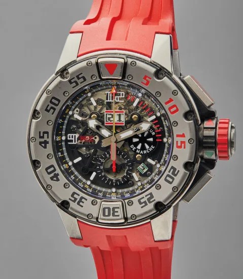 technical sport watch with red rubber strap