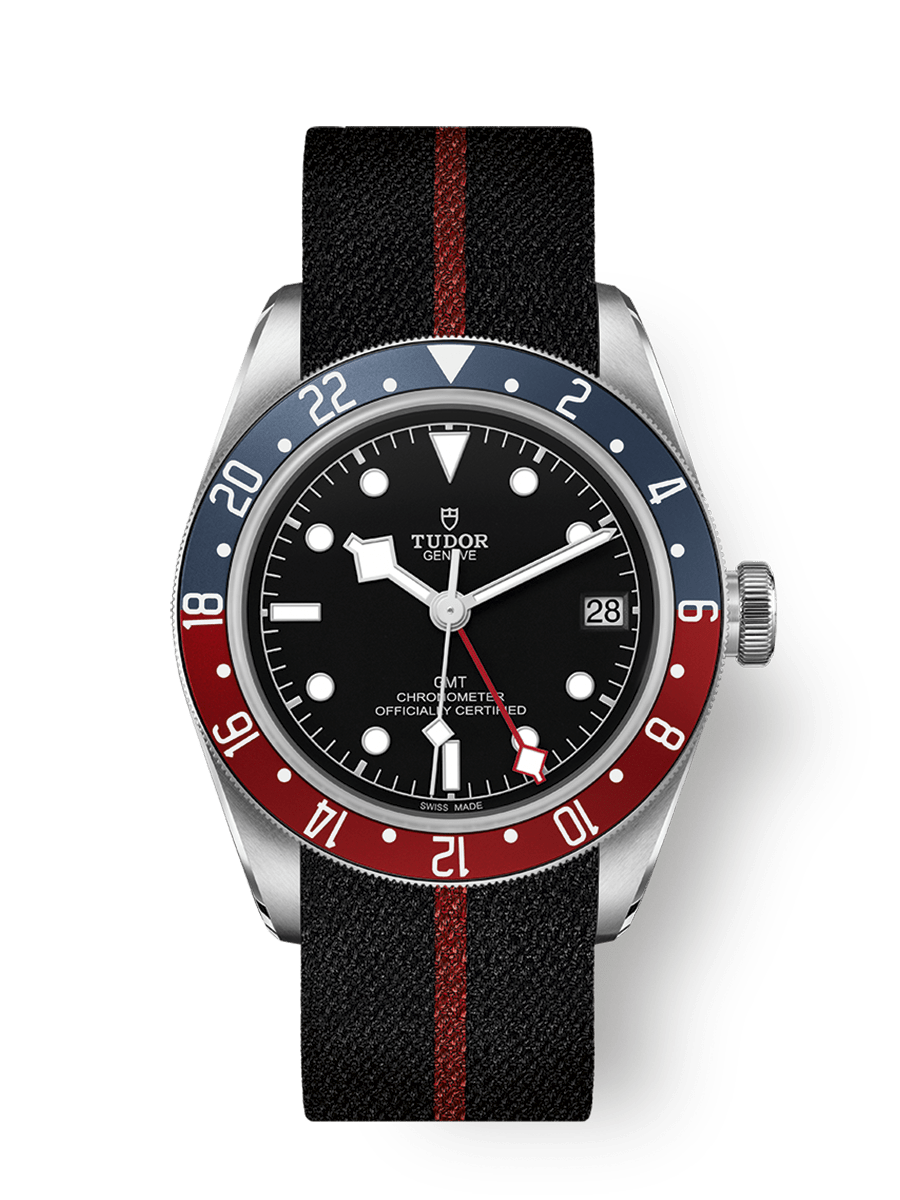 red and white bezel gmt watch on strap