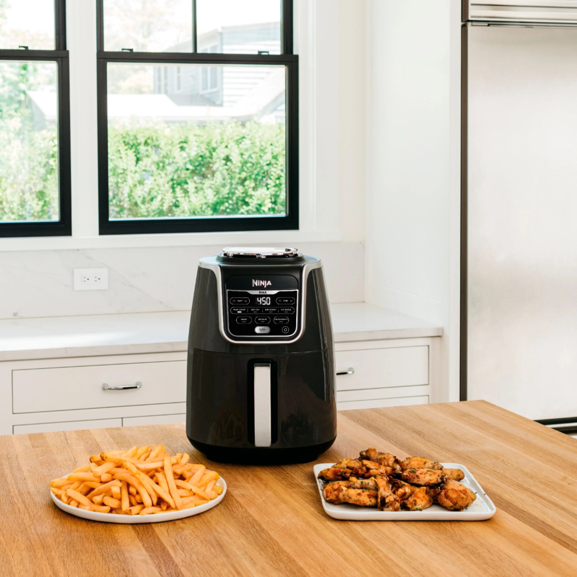 air fryer with fries and wings