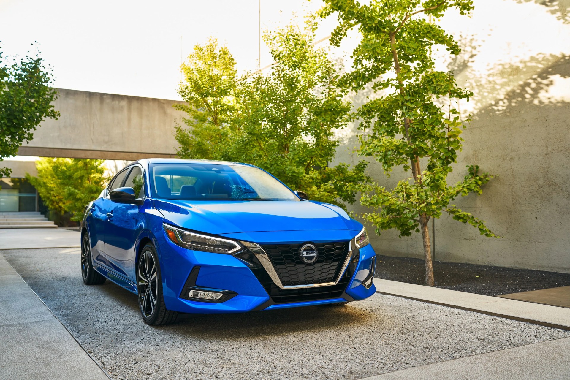 nissan sentra parked in a modernist driveway