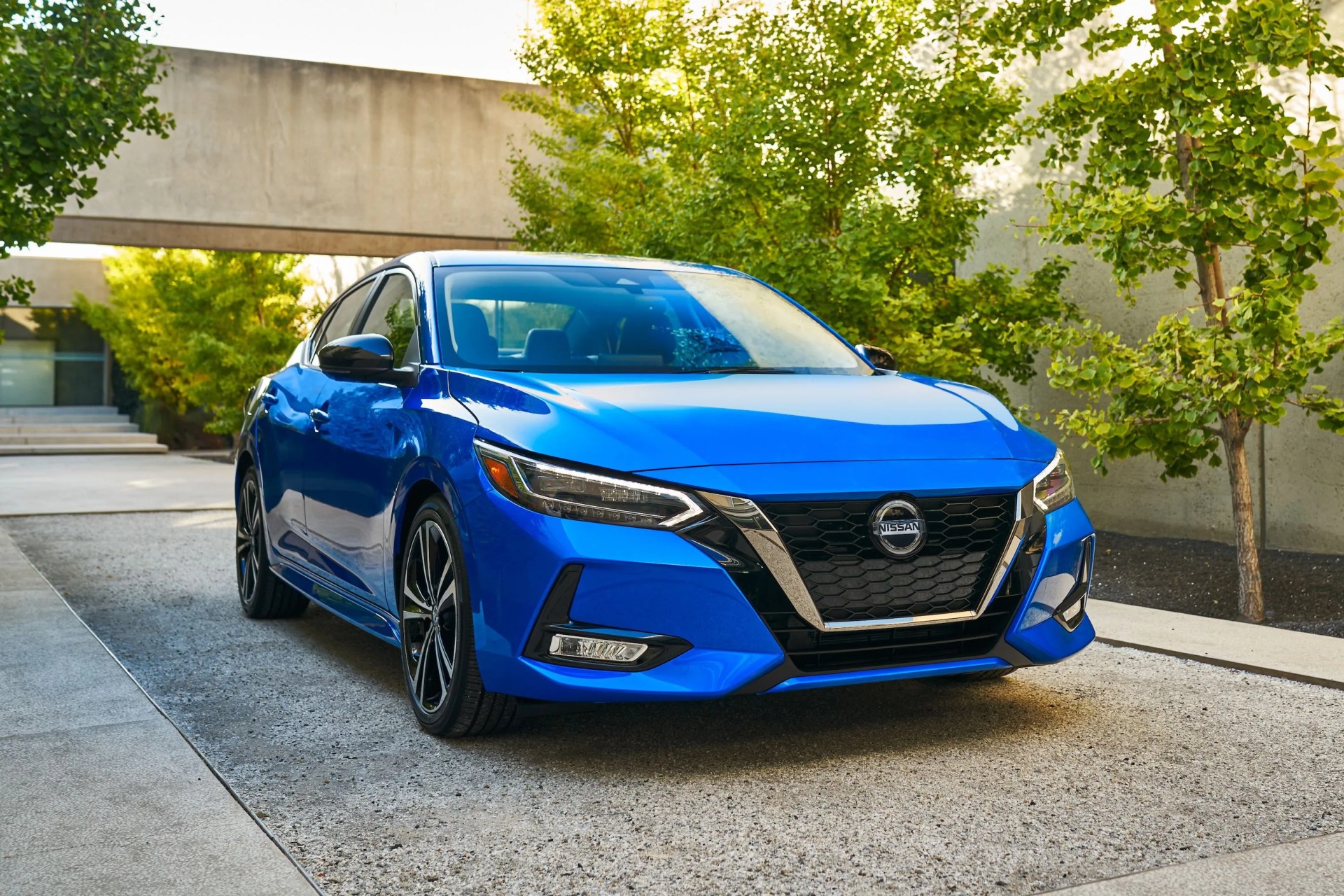 nissan sentra parked in a modernist driveway
