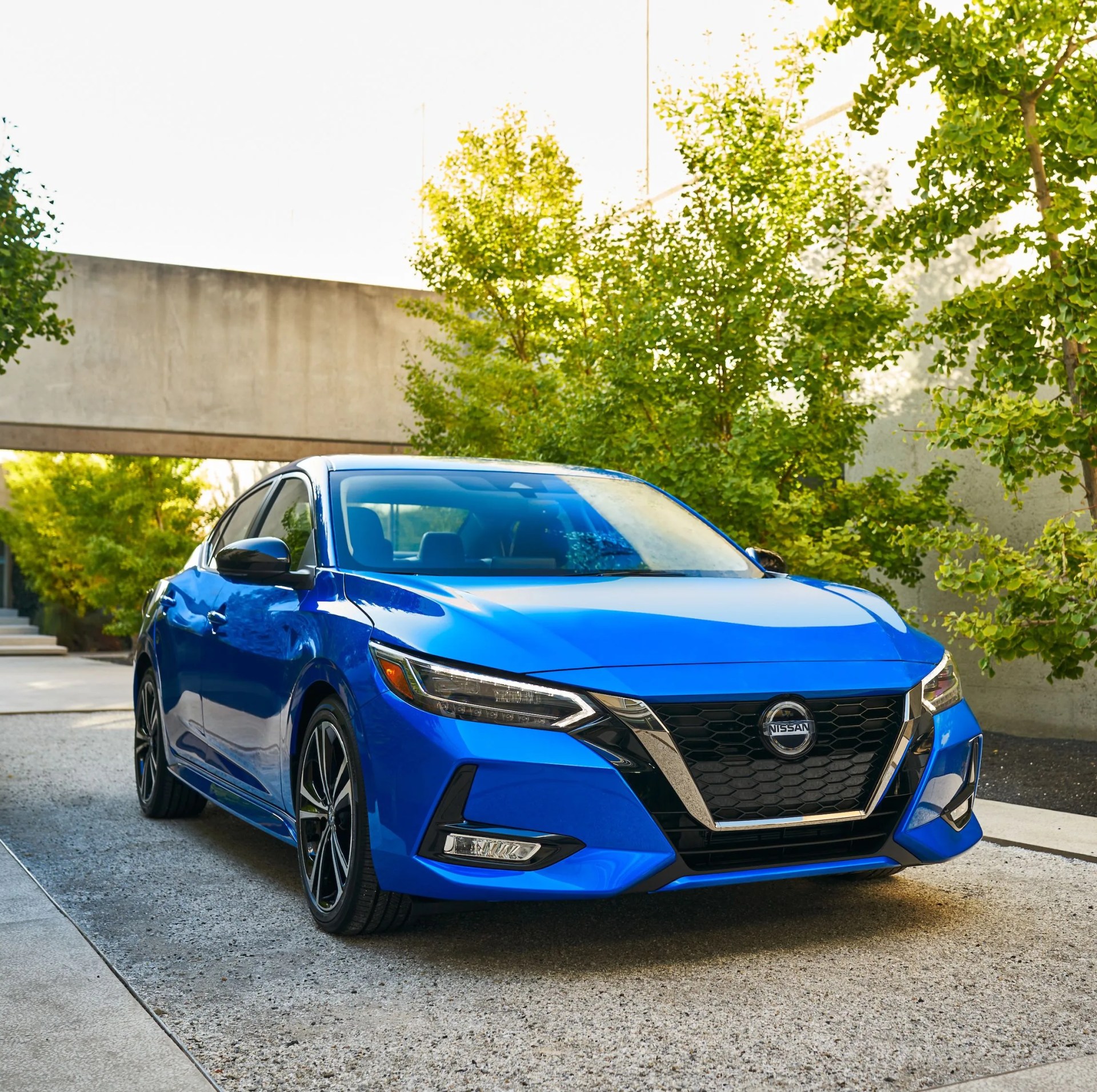 nissan sentra parked in a modernist driveway