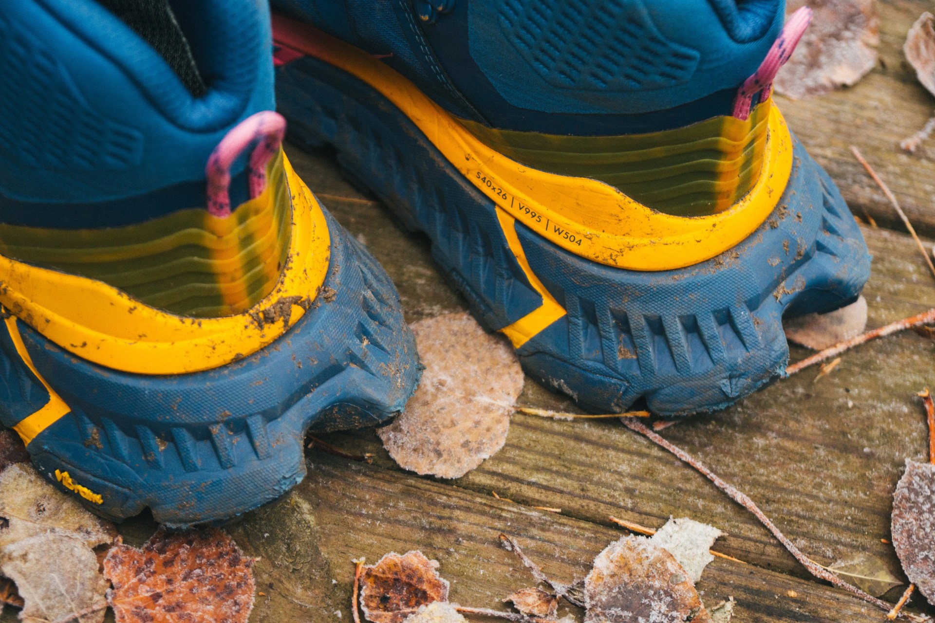 the extended heels of a blue hiking boot