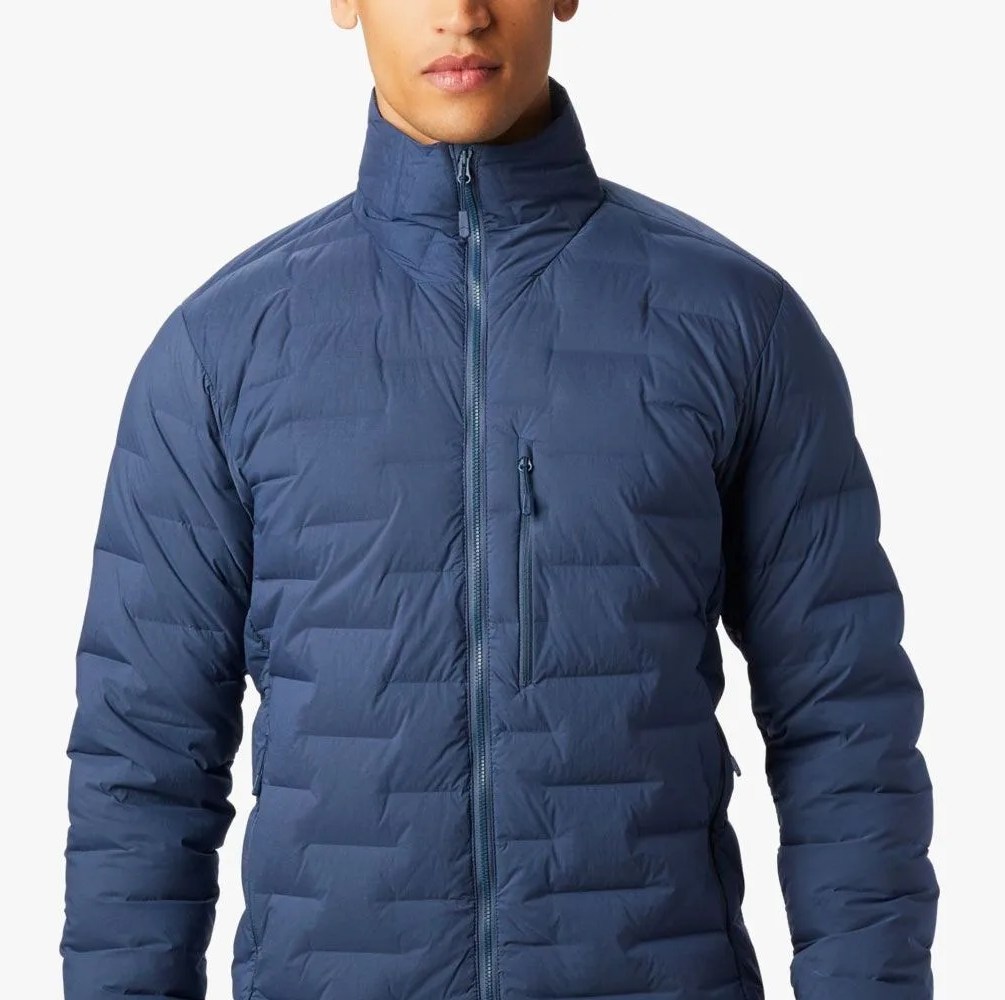 a man wearing a blue down jacket