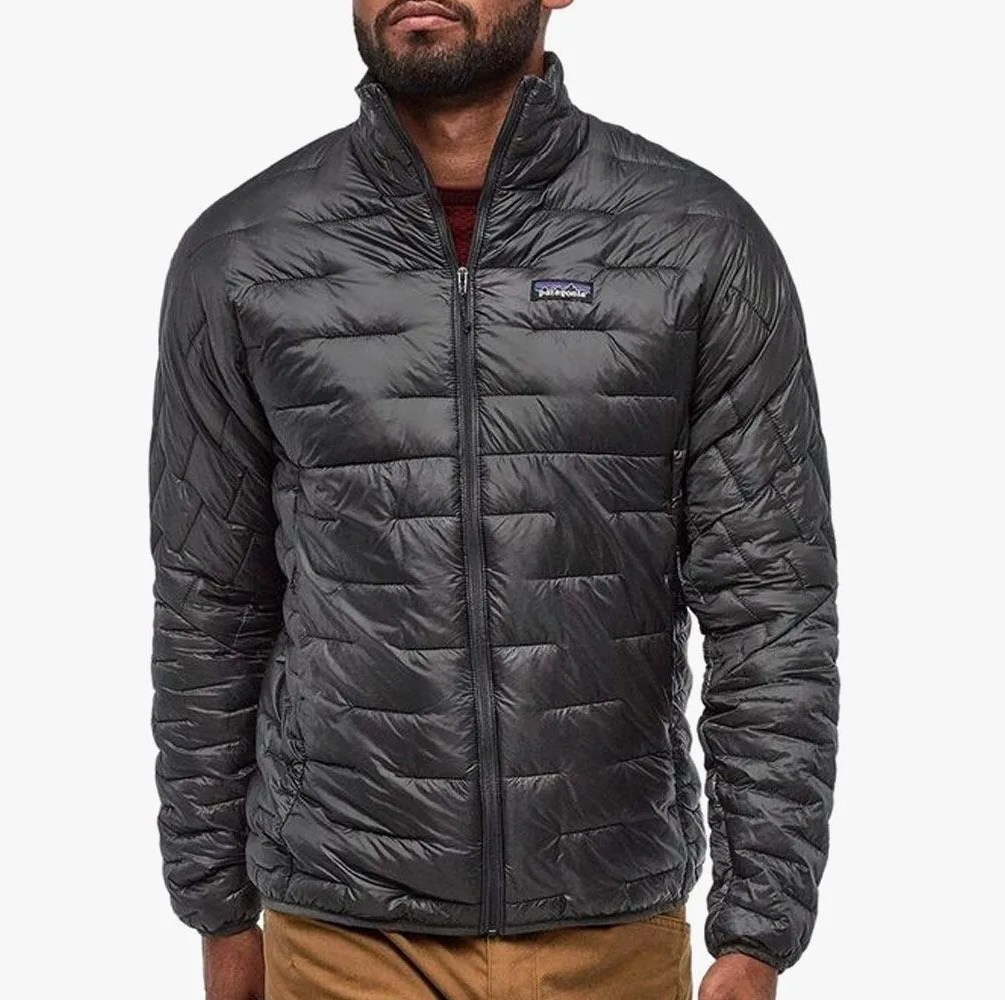 a man wearing a black insulated jacket