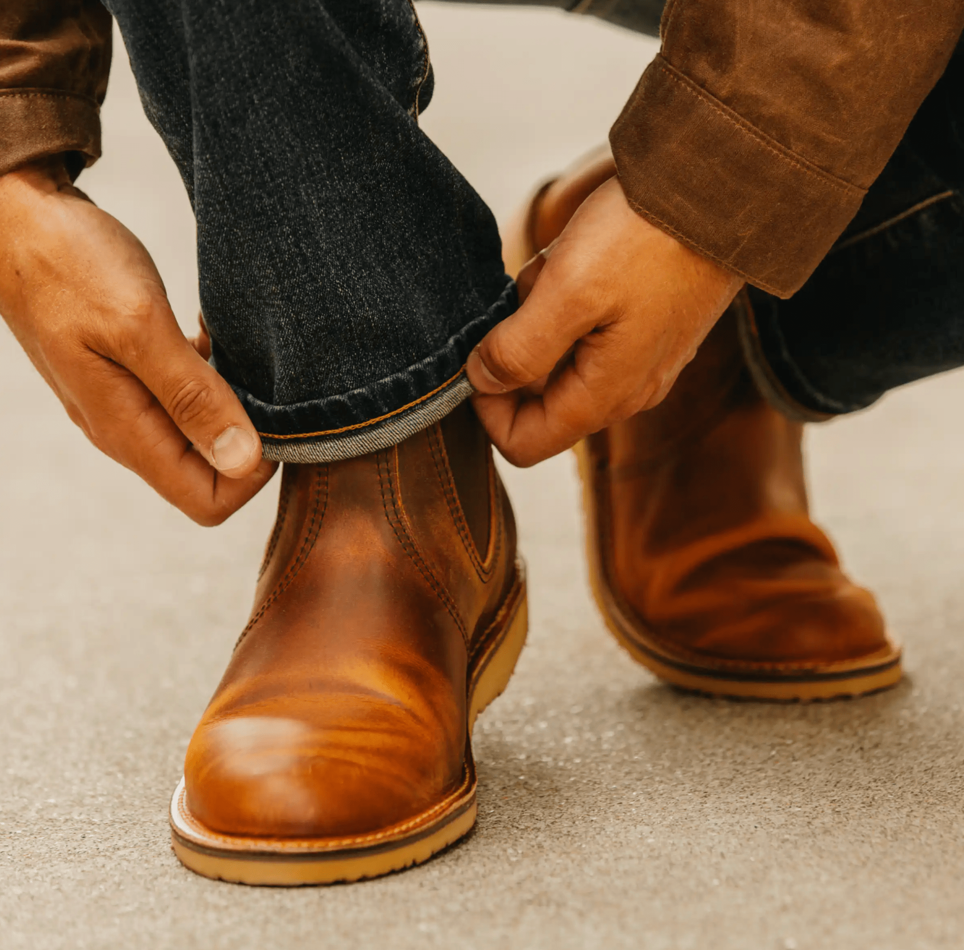 a model cuffing his jeans