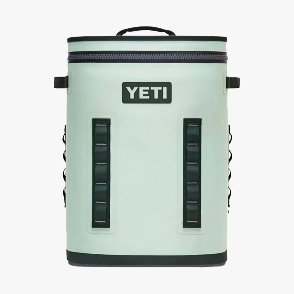 a teal backpack style cooler