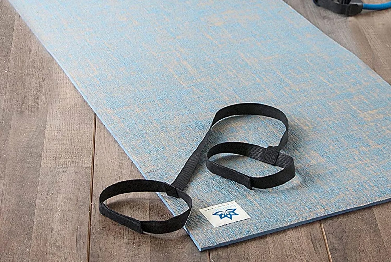 a yoga mat on a wooden floor