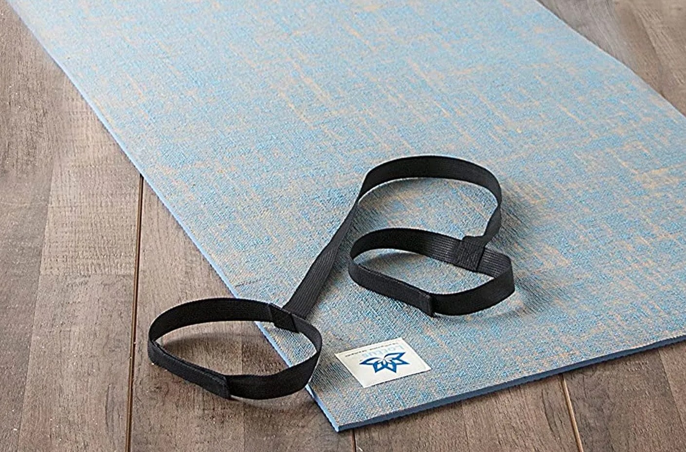 a yoga mat on a wooden floor
