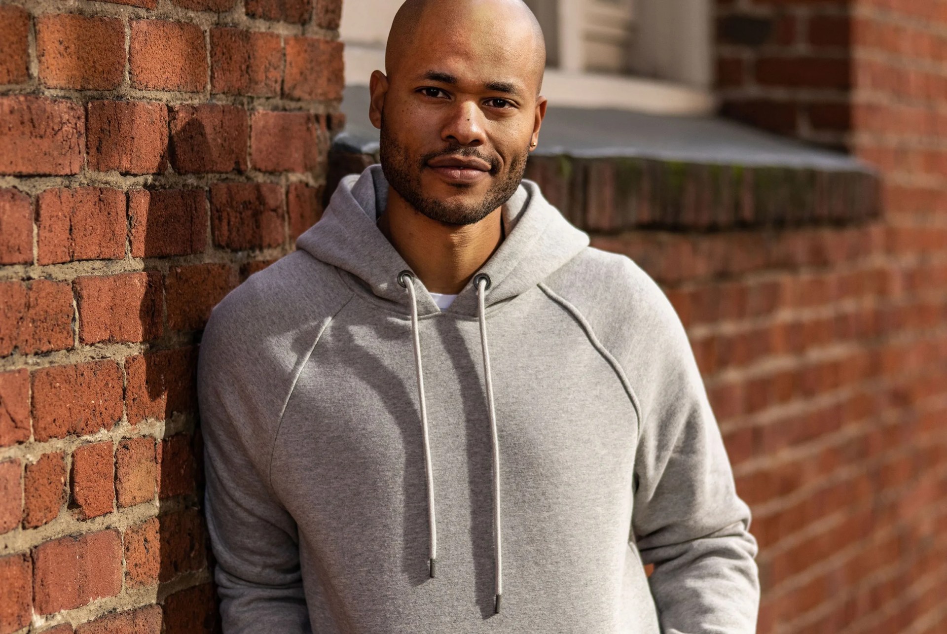 model wearing grey hoodie