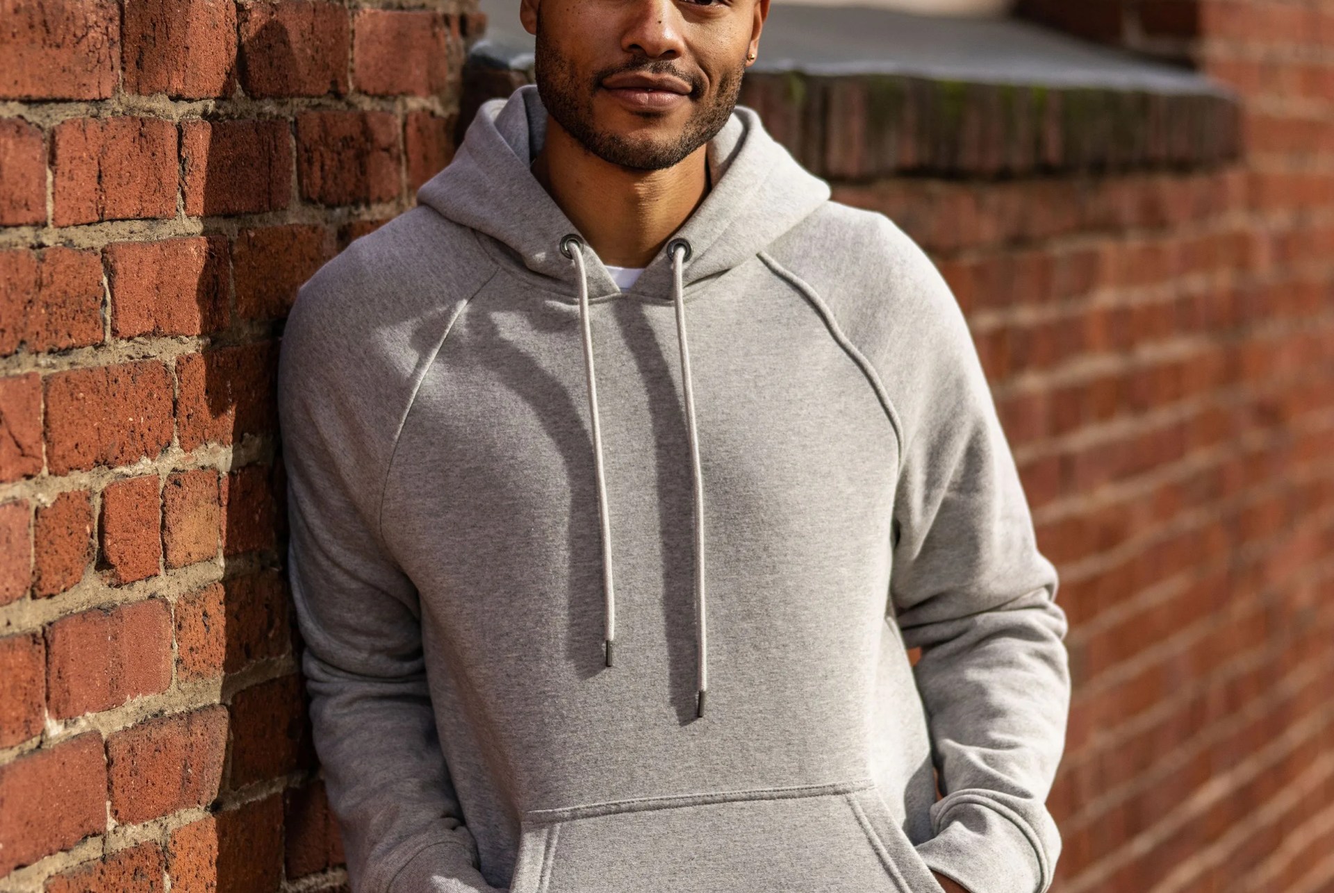 model wearing grey hoodie