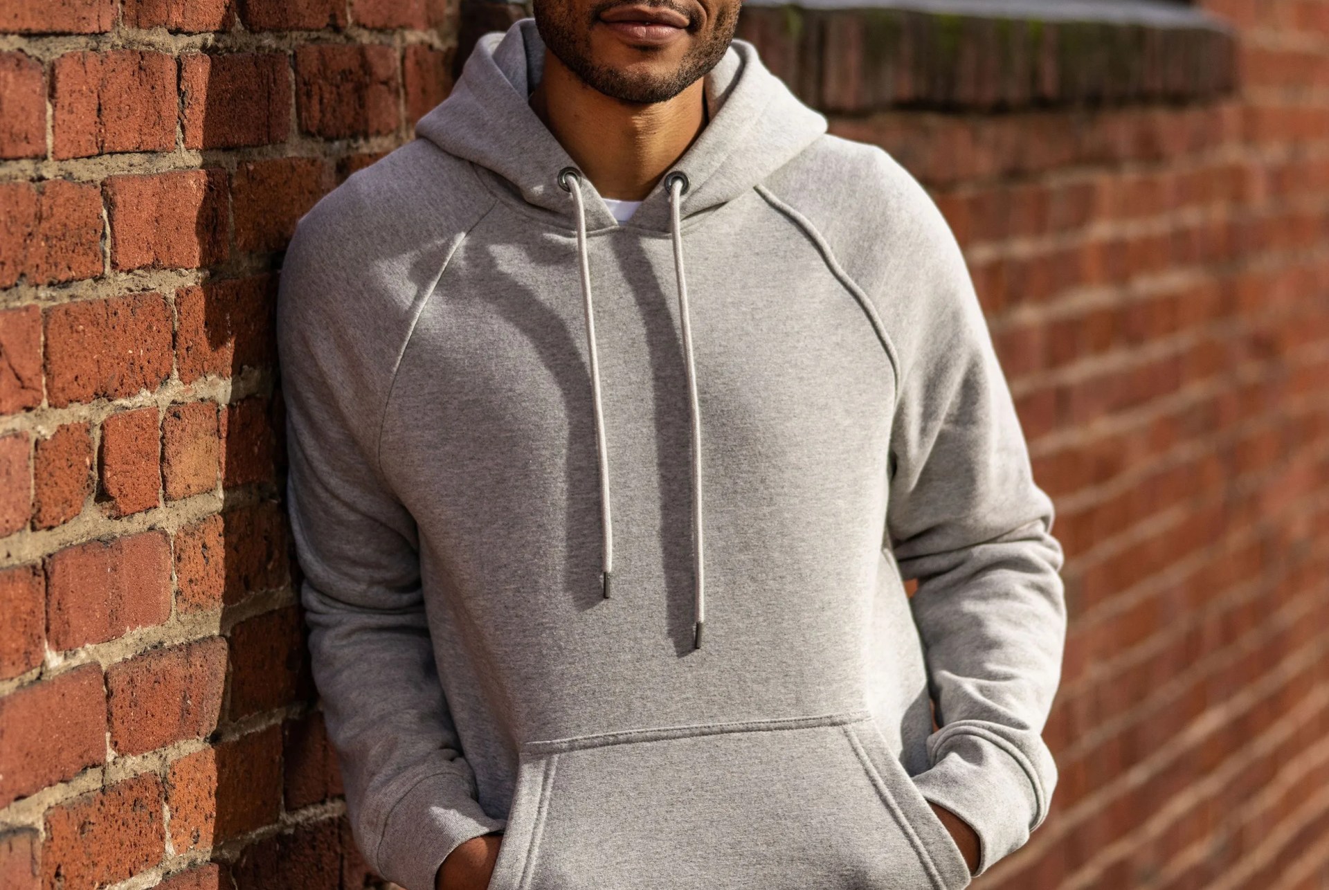 model wearing grey hoodie