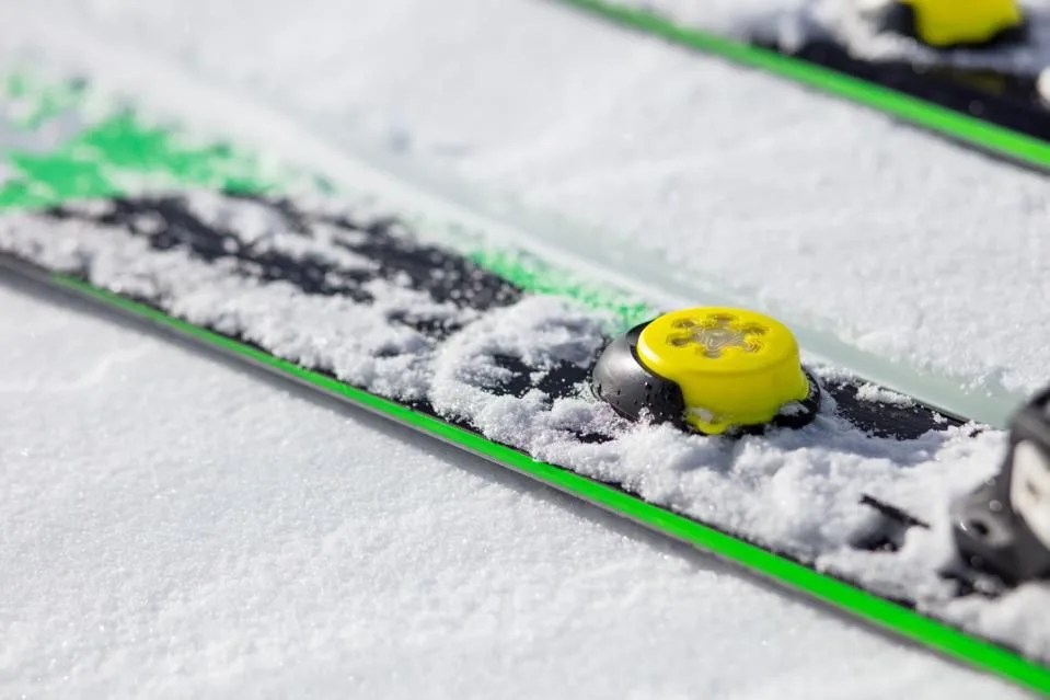 a yellow sensor on a ski