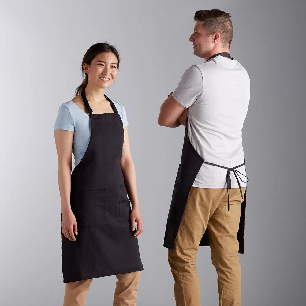 woman and man wearing apron
