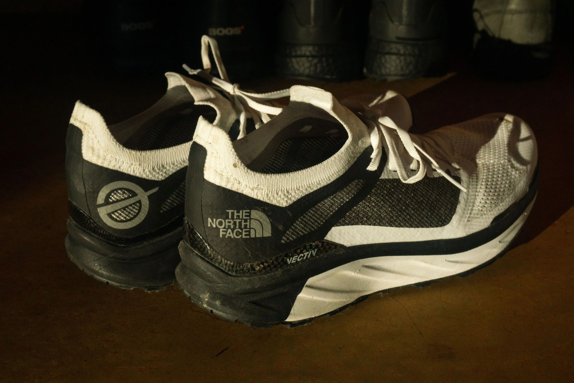 a pair of white and black running shoes