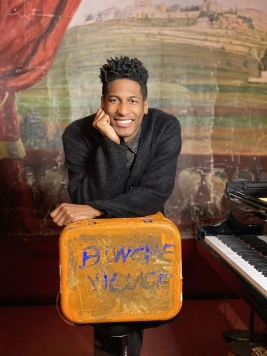 jon batiste standing with a yeti cooler
