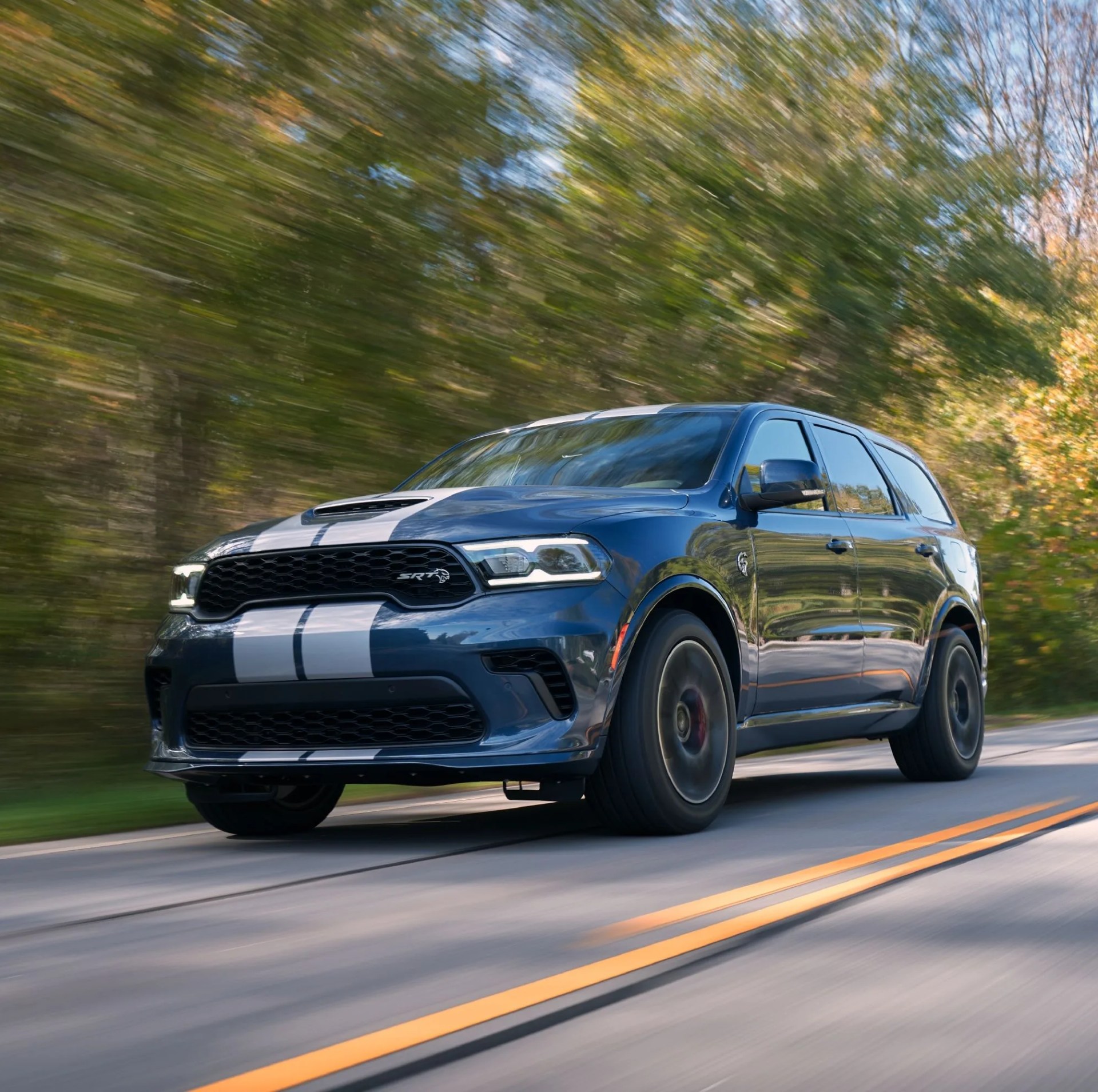 2021 dodge durango srt hellcat the most powerful suv ever features a new aggressive exterior, a new interior with a driver centric cockpit and delivers 710 horsepower, shown here in reactor blue with dual silver stripes