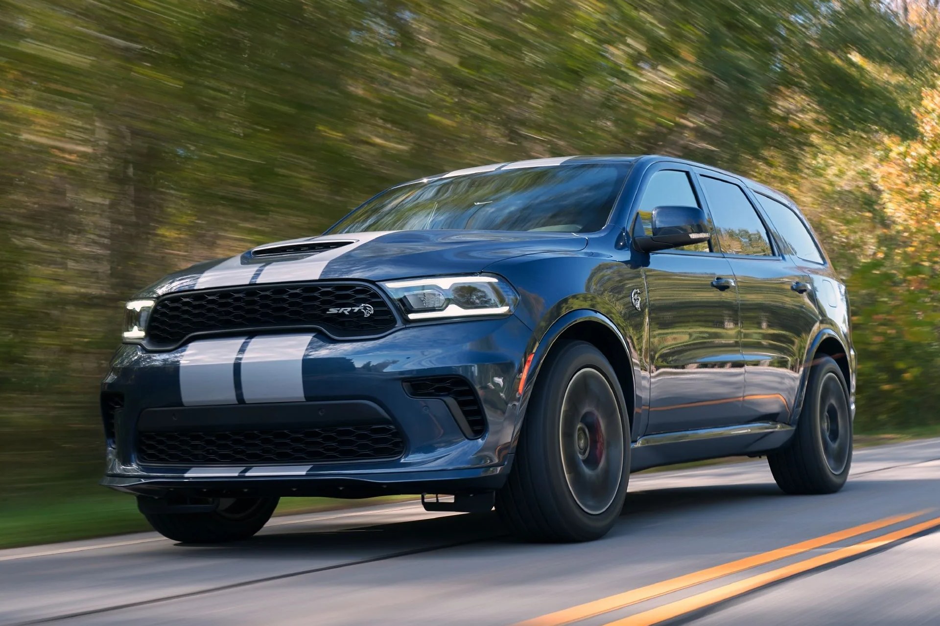 2021 dodge durango srt hellcat the most powerful suv ever features a new aggressive exterior, a new interior with a driver centric cockpit and delivers 710 horsepower, shown here in reactor blue with dual silver stripes