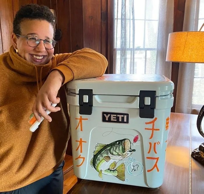 brittany howard standing with a yeti cooler