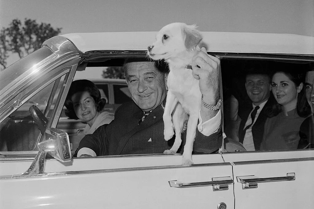 president johnson holding dog