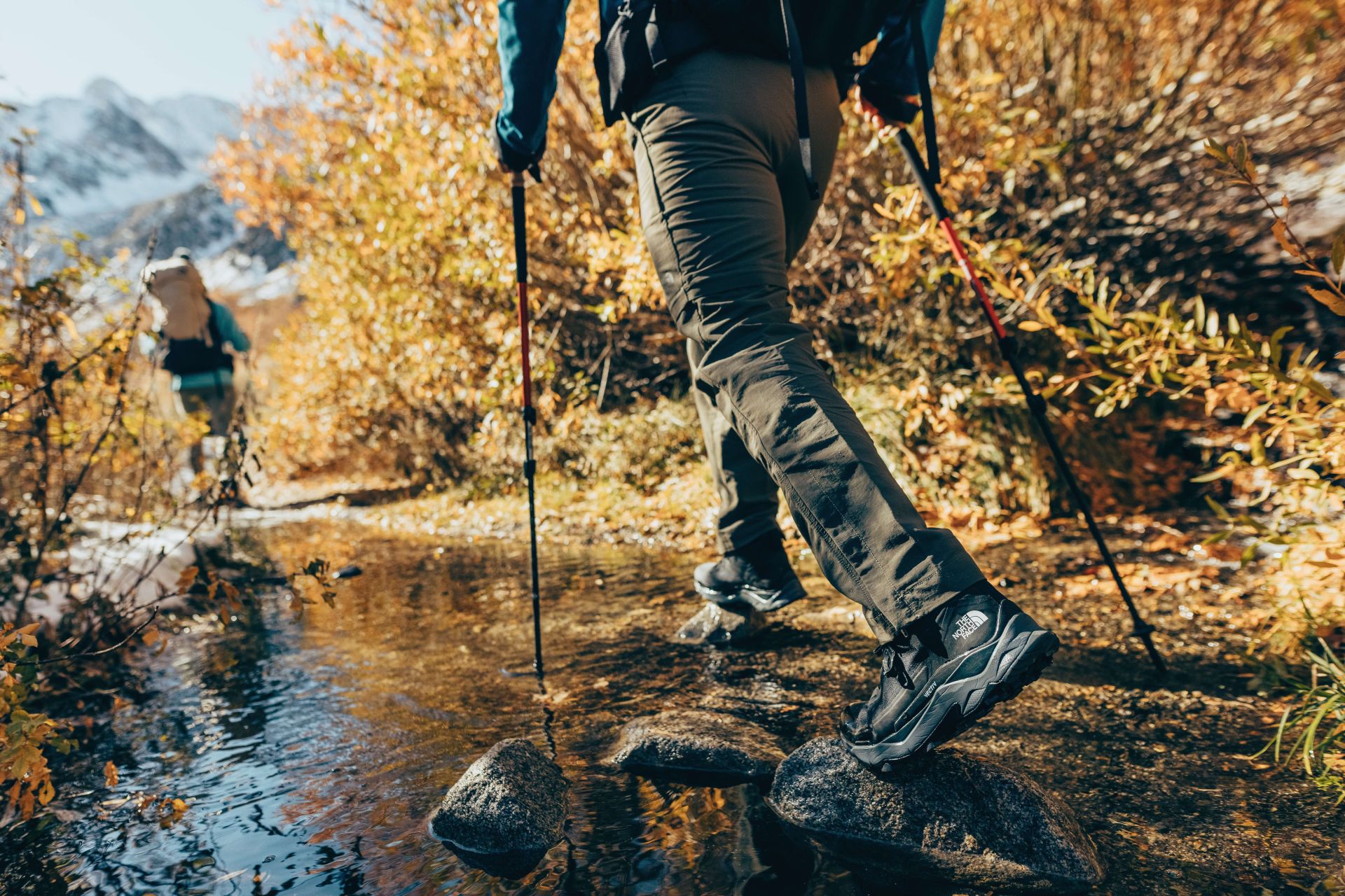 a person hiking in black boots