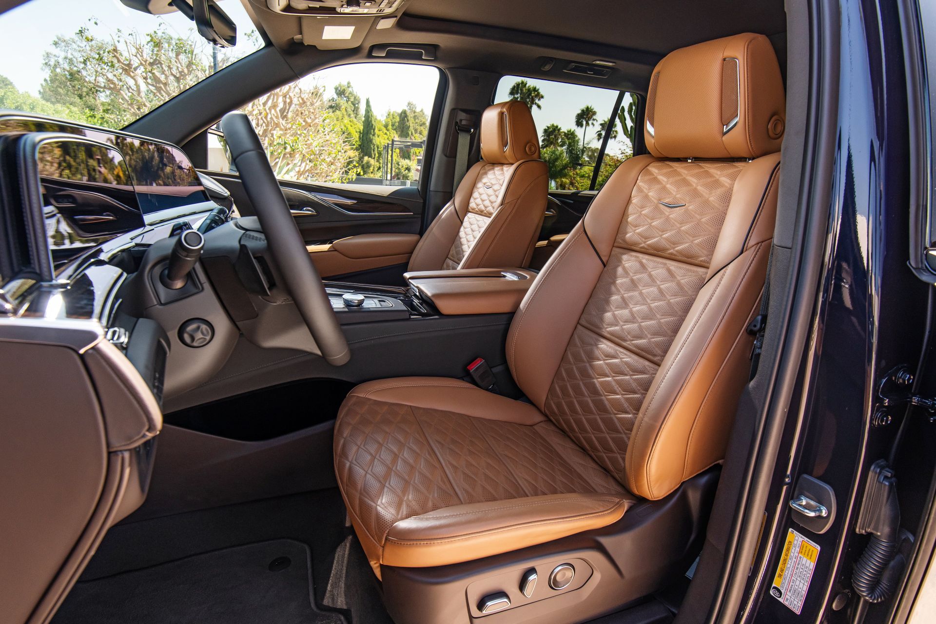 the 2021 cadillac escalade brandy interior with very dark atmosphere accents and full leather seats with faceted quilting