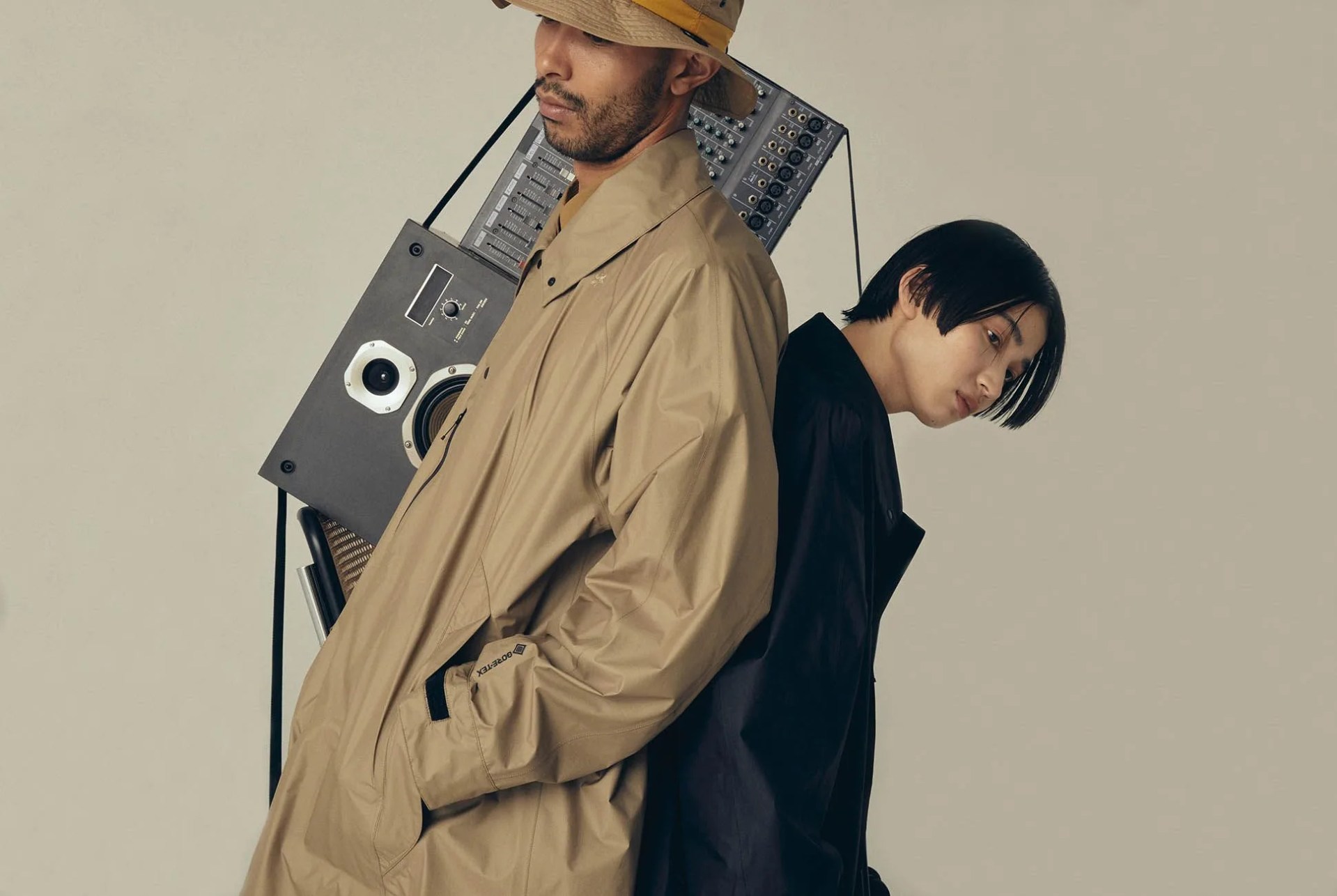 man wearing goldwin mackintosh raincoat