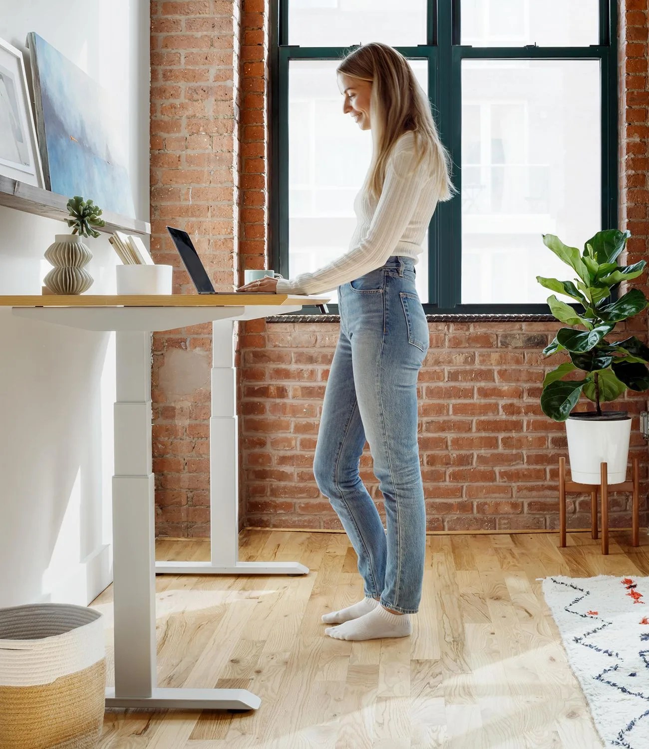 blonde woman standing at branch work desk