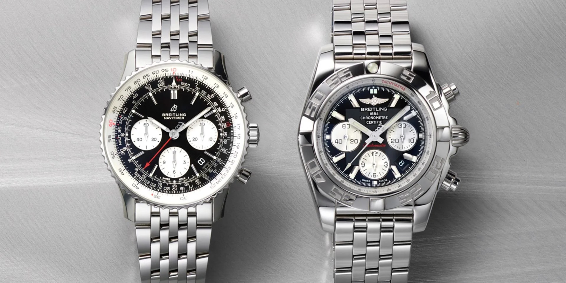 two silver breitling watches