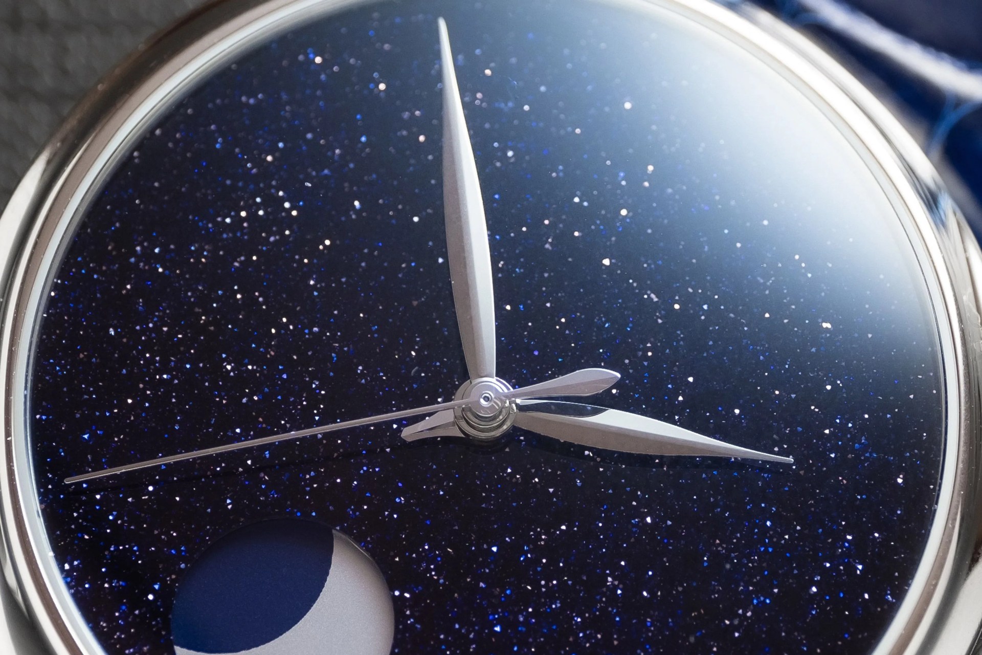 close up of aventurine dial of starry sky