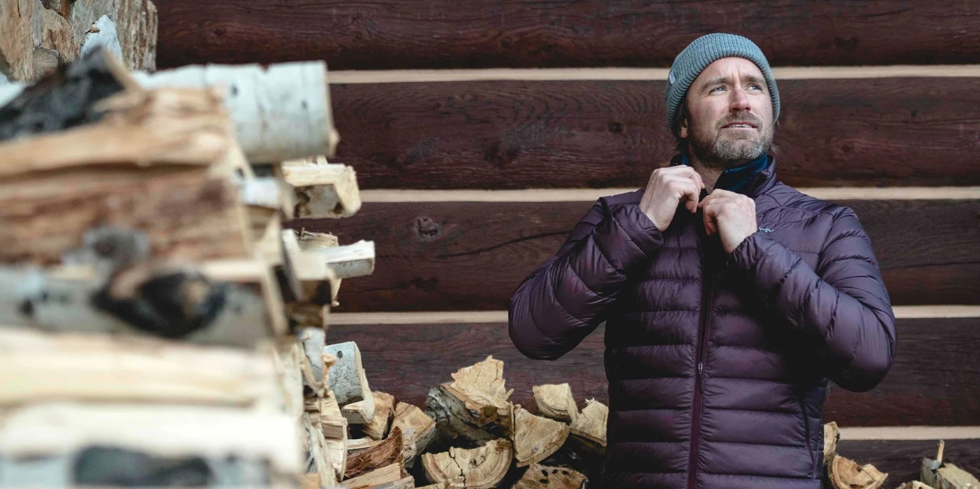man zipping up backcountry jacket