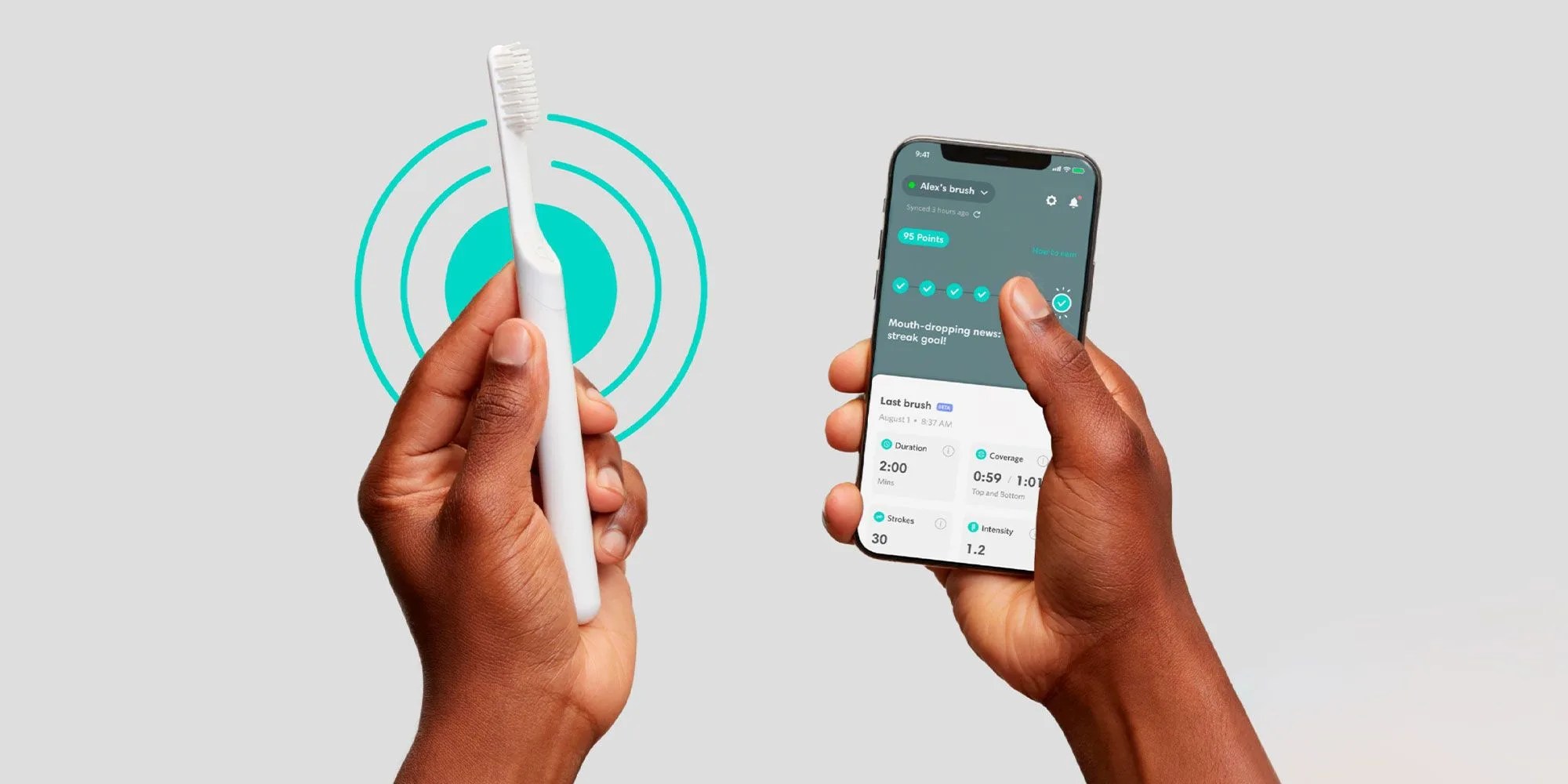 two hands holding a bluetooth quip toothbrush and phone