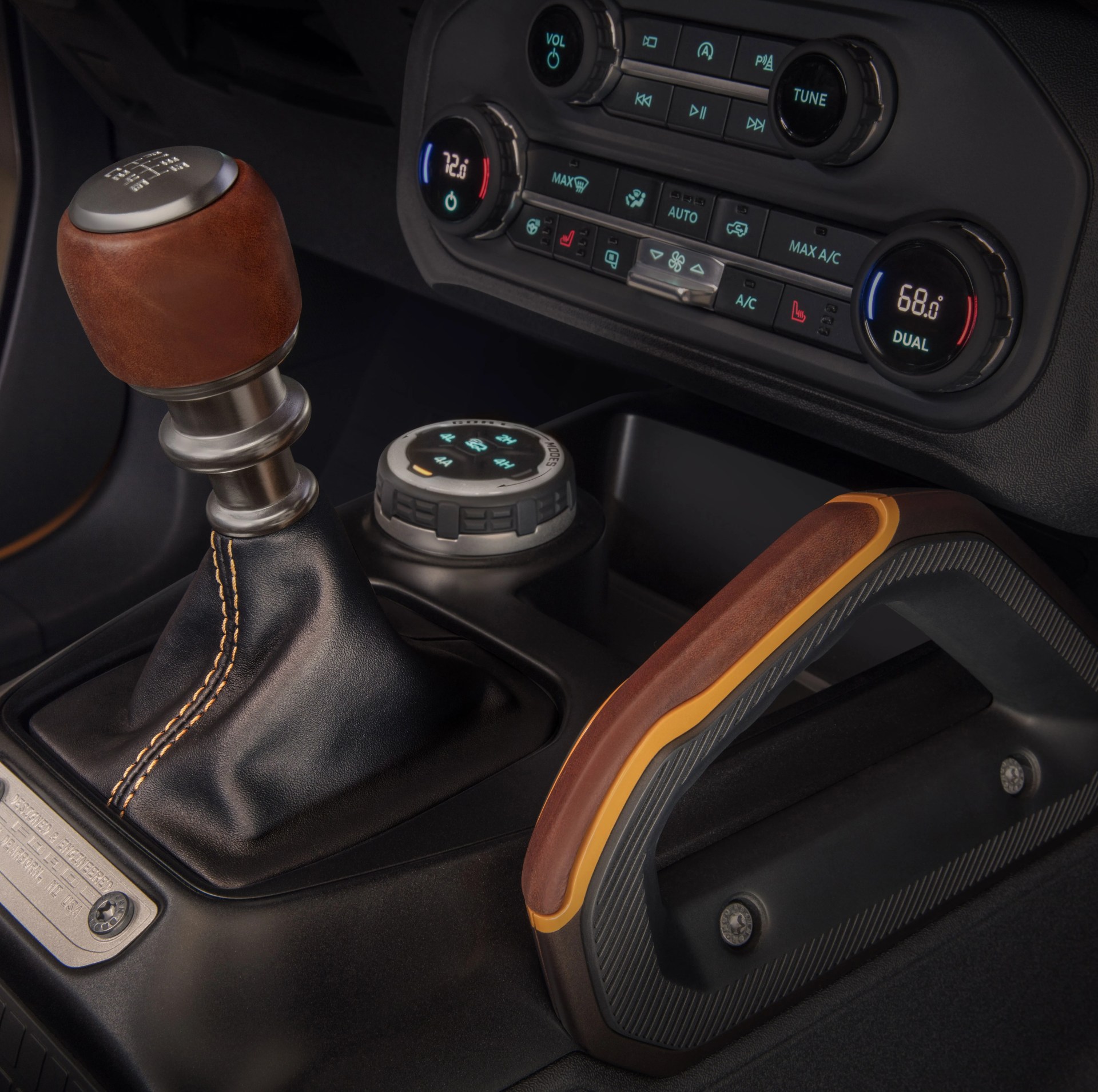 customization details include an available leather wrapped shift lever for the class exclusive 7 speed manual transmission, as well as grab handles in this prototype version of the 2021 bronco not representative of production model static display on private property with aftermarket accessories not available for sale