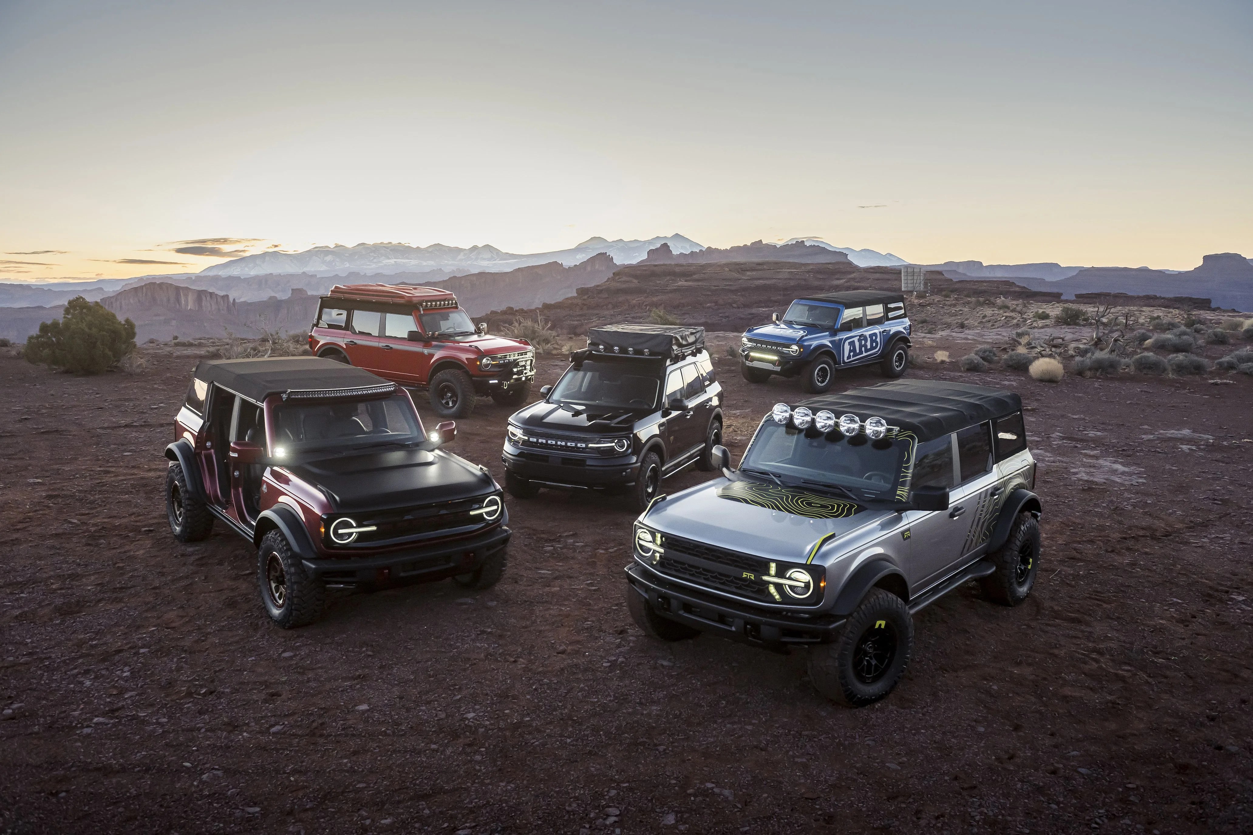 at the easter safari event in moab, utah, off road enthusiasts can drive various trails and see the all new 2021 bronco and bronco sport rugged suvs in person, along with the unveiling of several new custom builds by ford and aftermarket suppliers