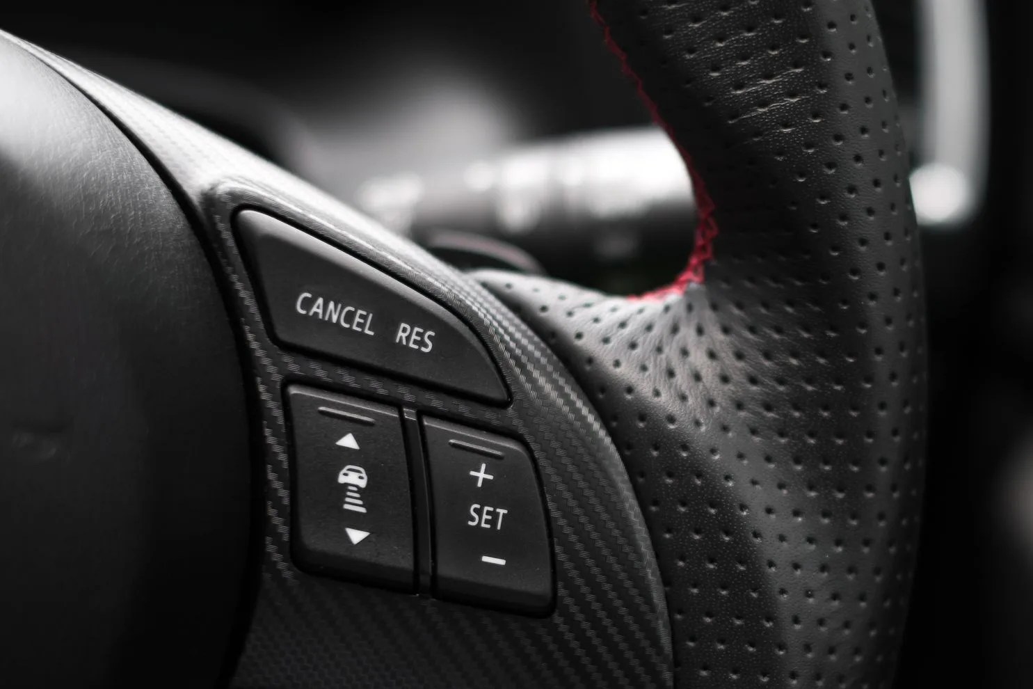 control buttons on steering wheel in a modern car