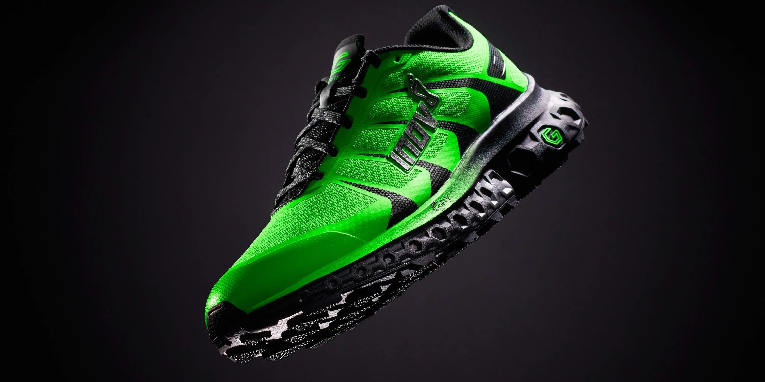 a green and black running shoe