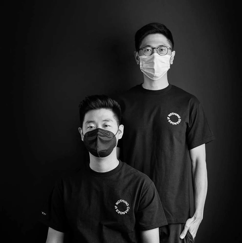 two men wearing t shirts