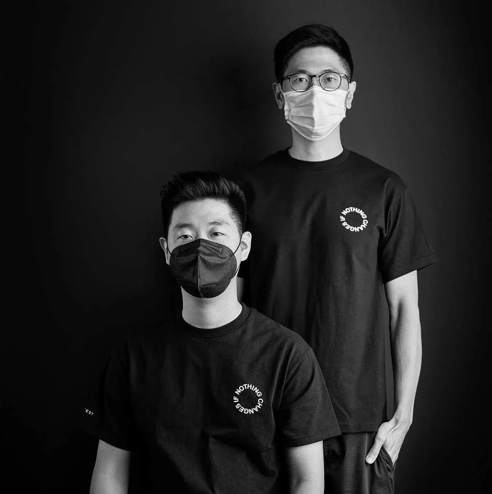 two men wearing t shirts