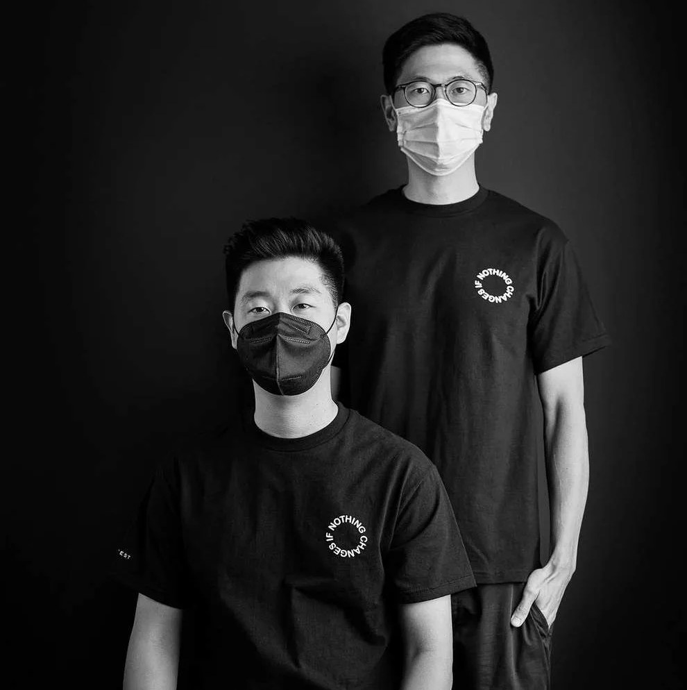 two men wearing t shirts