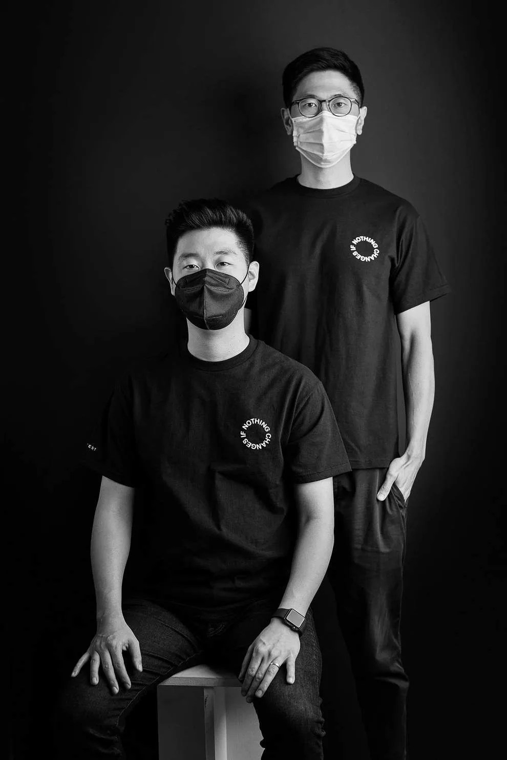 two men wearing t shirts