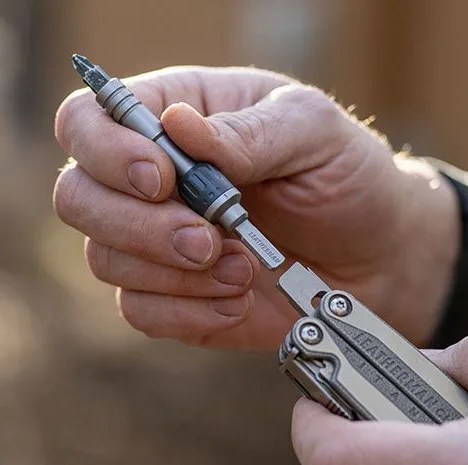hands holding a leatherman multi tool