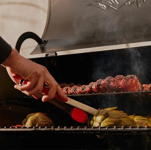 hand next to grill