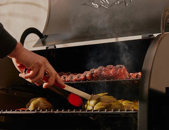 hand next to grill